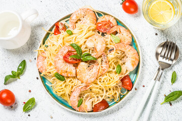 Pasta seafood with shrimp on white table.