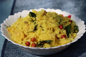 Poha or Kanda Poha popular Maharashtrian breakfast recipe made from red or white flattened rice,...
