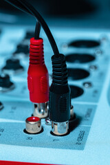 Rear panel of music system amplifier with wires