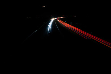 light trails on highway at night, long exposure photo