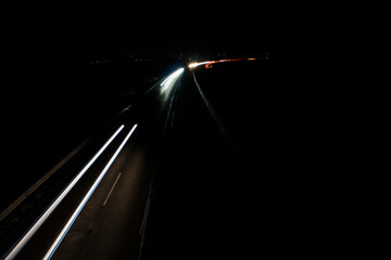 light trails on highway at night, long exposure photo
