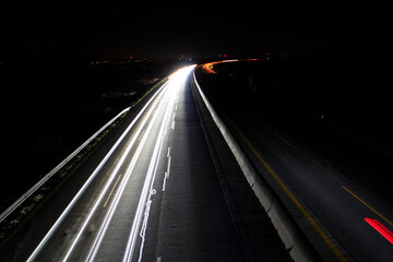 Fototapeta na wymiar light trails on highway at night, long exposure photo