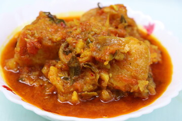 Dum aloo, potatoes in thick onion  tomato gravy 