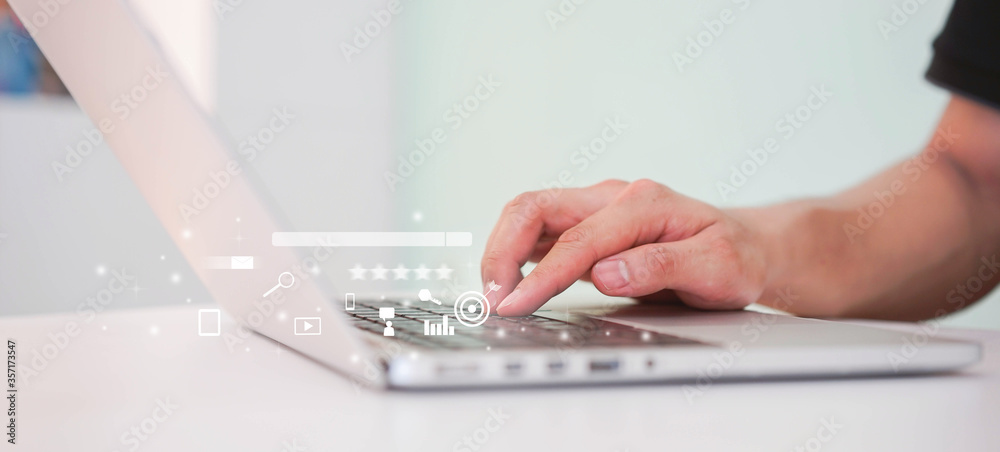 Wall mural close up man hand type on keyboard laptop to use search engine optimization (seo) tools for finding 