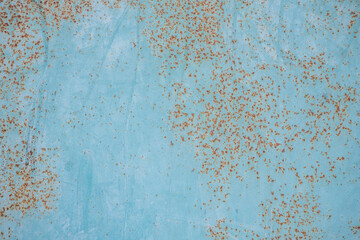 background and texture of old metal surface is covered with blue paint and rust