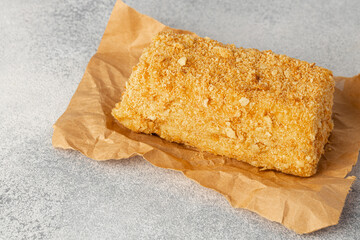Piece of honey cake on kitchen table