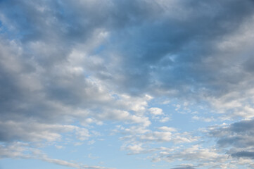 Natural sky composition. Sunny vast blue sky abstract background. Beautiful cloudscape, view over white fluffy clouds. Freedom concept, on the heaven. Element of design.