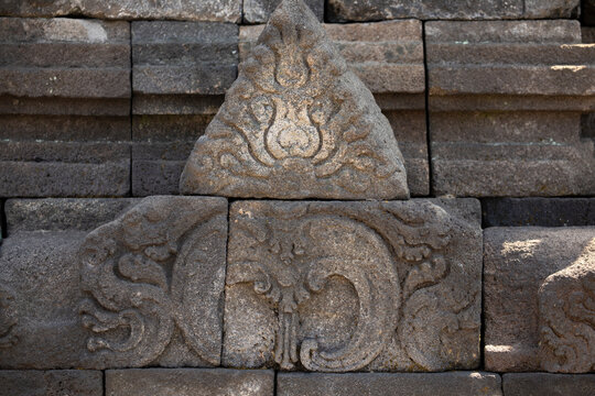 Detail of one of the antefixes that decorate the balustrades and stupas on the upper levels of the Borobudur temple, Central Java, Indonesia.