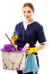 Young woman holding cleaning tools and products in bucket, isolated on white