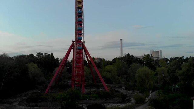 Cinematic Aerial View of Ferris Wheel in Abandoned Amusement Park in East Berlin, Germany