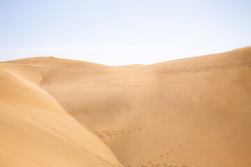 sand dunes against clear blue sky in Maspalomas, Gran Canaria