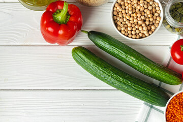 Two cucumbers on wooden kitchen table close up