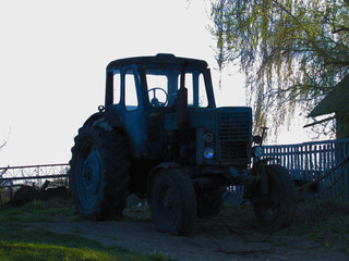 Old tractor near the field.