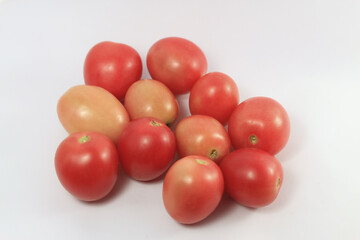 Delicious red tomatoes on white background