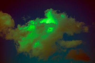 Dark sky with an unusual green cloud.
