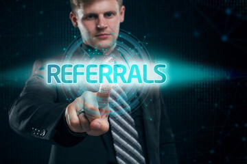 Businessman presses button referrals on virtual screens. Business, Technology, Internet and network concept.