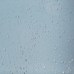 Raindrops on the window close up.
