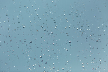 water drop on the blue glass after rain