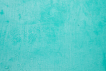 Texture concrete wall with sheltered blue and green paint closeup