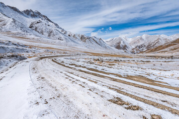the gravel road on the snow mountain