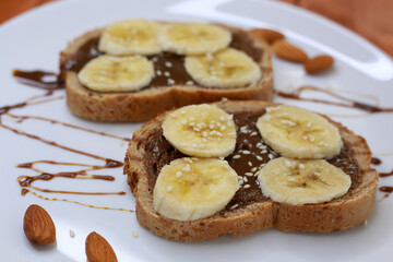 healthy dessert with chocolate paste and bananas