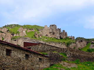 Eastern outskirt of Goris, Armenia, and beginning of so called Stone Forest, reserve of pyramid-like geological formations and ancient caves. All these rocks are part of Zangezur Mountains