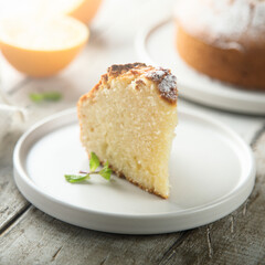 Homemade orange cake on a white plate