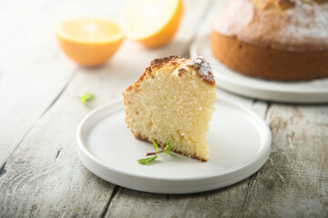 Homemade orange cake on a white plate