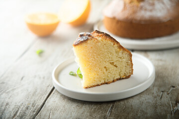 Homemade orange cake on a white plate