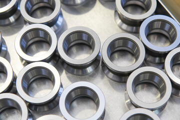 Close up on ball bearings lined up.