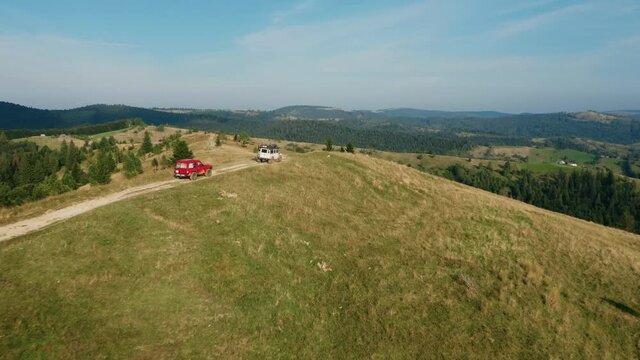 Beautiful mountain landscape with off-road driving,  several jeeps go off-road