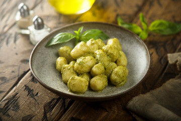 Homemade potato gnocchi with pesto sauce