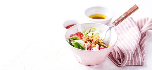Fresh salad with couscous, tomatoes, cucumber, radish and chard.