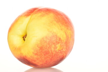 Ripe juicy organic nectarine, macro, on a white background.