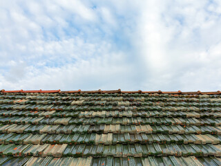 Tile roofed traditional wooden vintage home. Selective focus
