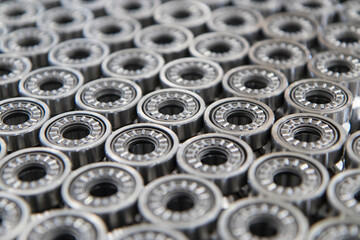 Close up on ball bearings lined up.