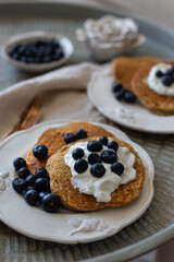 Healthy breakfast concept. Oatmeal pancakes with yogurt and blueberries.