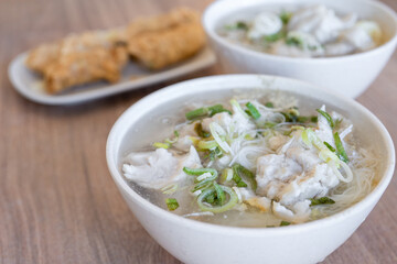 Delicious fish ball rice noodles in thick soup, common food in Tainan, Taiwan, Asia, Asian Taiwanese street delicacy cuisine, close up, lifestyle.