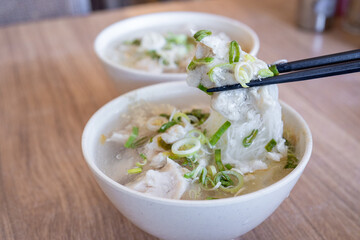 Delicious fish ball rice noodles in thick soup, common food in Tainan, Taiwan, Asia, Asian Taiwanese street delicacy cuisine, close up, lifestyle.