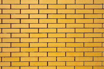 yellow bricks in masonry wall