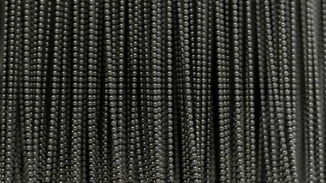 The curtain / wall made of metal balls hanging on the strings creates an ideal background. Magnetically attracted metal. The animation is looped.