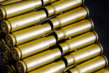 bullet shell cartridges on a black background closeup view