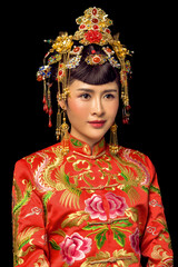 Girl wearing ancient Asian bride dress in black background