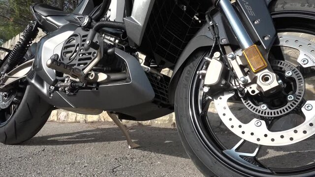 Front wheel of a black motorbike
