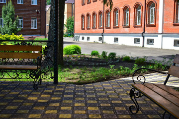view from the gazebo to the flower garden and brick wall
