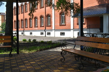 view from the gazebo to the flower garden and brick wall