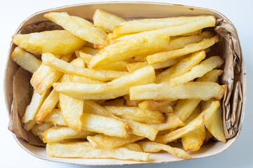 homemade deep fried french fries on wooden basket