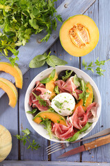 melon salad with mozzarella and prosciutto ham