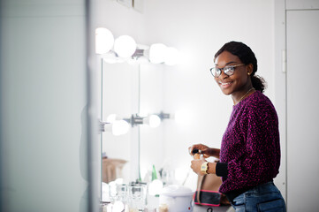 Fototapeta na wymiar African American woman make-up artist at beauty saloon.