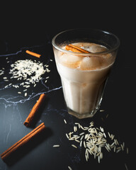 Mexican Rice Drink Horchata, Black Marble Table, Cinnamon and Rice garnish  